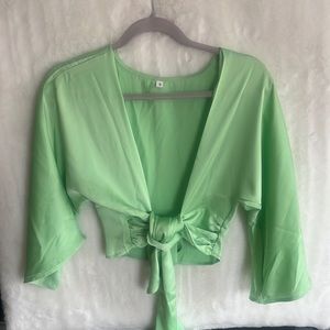 Beautiful, lime green cropped around the stomach shirt